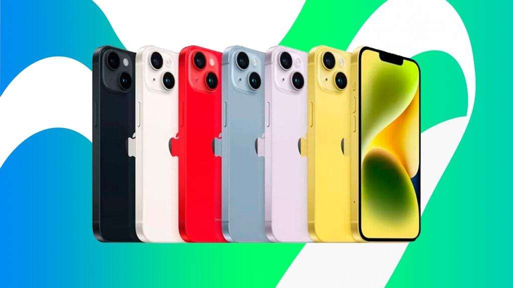 A imagem mostra uma linha de iPhones 14 em várias cores. Da esquerda para a direita, as cores são preto, branco, vermelho, azul, lilás e amarelo. Cada iPhone está posicionado de forma que a parte traseira e a lateral sejam visíveis, exceto o último iPhone amarelo, que está de frente, exibindo a tela inicial. A imagem é interessante e relevante porque destaca a variedade de cores disponíveis para o iPhone 14, o que pode atrair diferentes preferências de consumidores.