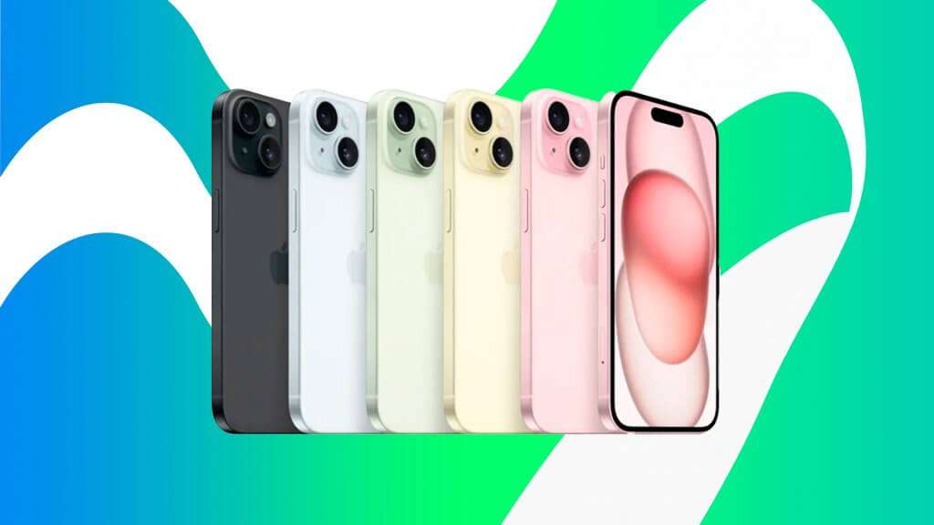 A imagem mostra uma linha de iPhones 15 em várias cores. Da esquerda para a direita, as cores são preto, azul claro, verde claro, amarelo claro, rosa claro e um iPhone com a tela ligada exibindo um fundo rosa. A imagem é interessante e relevante porque destaca as diferentes opções de cores disponíveis para o iPhone 15, o que pode atrair consumidores interessados em personalizar a aparência de seus dispositivos.